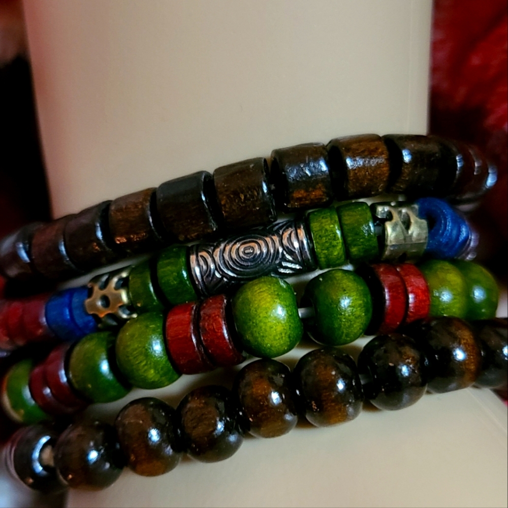 FOUR DELICATE WOODEN BEADS BRACELETS